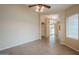 Inviting living area with neutral paint, tile flooring, and abundant natural light at 10722 W Irma Ln, Peoria, AZ 85373