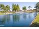 Scenic view of a pond with a fountain, creating a peaceful and inviting community atmosphere at 10722 W Irma Ln, Peoria, AZ 85373