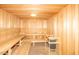 Relaxing wooden sauna room with bench seating, offering a spa-like experience at 10722 W Irma Ln, Peoria, AZ 85373