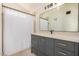 Modern bathroom featuring a sleek vanity, contemporary mirror, and shower for a luxurious and functional space at 11531 E Persimmon Ave, Mesa, AZ 85212