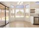 Dining area featuring a sliding glass door to the backyard and tile floors at 11531 E Persimmon Ave, Mesa, AZ 85212