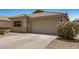 Beautiful home featuring a tile roof, two-car garage, and desert landscaping at 11531 E Persimmon Ave, Mesa, AZ 85212