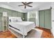 Cozy bedroom featuring paneled walls, neutral rug and bright natural light at 1233 E El Camino Dr, Phoenix, AZ 85020