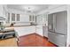 Charming kitchen featuring white cabinets, updated appliances and stylish design at 1233 E El Camino Dr, Phoenix, AZ 85020