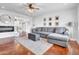 Inviting living room with a comfortable couch, stylish rug, and ample natural light at 1233 E El Camino Dr, Phoenix, AZ 85020