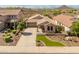 An attractive single-Gathering home featuring desert landscaping, artificial turf, and a two-car garage at 12712 W Milton Dr, Peoria, AZ 85383