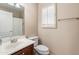 Cozy bathroom with a shower, single sink vanity, and a toilet at 12712 W Milton Dr, Peoria, AZ 85383