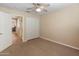 Bedroom with neutral walls, plush carpeting and a closet with sliding doors at 12712 W Milton Dr, Peoria, AZ 85383