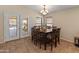 Bright dining room with backyard access and decorative chandelier at 12712 W Milton Dr, Peoria, AZ 85383