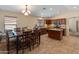 Warm and inviting kitchen with wood cabinets, granite countertops, and an adjacent dining area at 12712 W Milton Dr, Peoria, AZ 85383