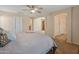 Spacious main bedroom with ceiling fan and easy access to other areas of the home at 12712 W Milton Dr, Peoria, AZ 85383