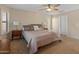 Inviting main bedroom featuring a ceiling fan and access to a private balcony at 12712 W Milton Dr, Peoria, AZ 85383