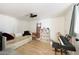 Versatile bedroom with a trundle bed, a piano, laminate floors, and natural light at 12810 N 20Th St, Phoenix, AZ 85022