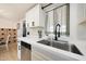 Bright kitchen features white cabinetry, stainless steel appliances, and a deep sink with modern fixtures at 12810 N 20Th St, Phoenix, AZ 85022