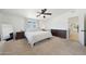 Comfortable main bedroom with carpeted floors, a ceiling fan, and a bright window for natural light at 12810 N 20Th St, Phoenix, AZ 85022