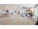 Spacious open floor plan featuring a modern kitchen, dining area, and living room with contemporary finishes at 12810 N 20Th St, Phoenix, AZ 85022
