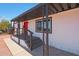Exterior view of front porch showing access steps and decorative handrail, with a view of the entry at 12810 N 20Th St, Phoenix, AZ 85022