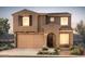 Charming two-story home with a two-car garage, desert landscaping, and a welcoming entrance at 13557 W Cassia Trl, Peoria, AZ 85383