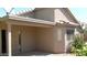 Covered back patio provides shade and outdoor living space with desert landscaping at 13861 W Elm St, Surprise, AZ 85374
