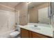 Bathroom featuring a shower-tub combo and a vanity at 13861 W Elm St, Surprise, AZ 85374