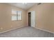 Bedroom with natural light, a closet, and neutral carpet at 13861 W Elm St, Surprise, AZ 85374