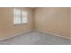 Bedroom with a window, neutral walls, and carpet at 13861 W Elm St, Surprise, AZ 85374