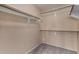 Walk-in closet with ample shelving and a neutral color scheme at 13861 W Elm St, Surprise, AZ 85374