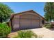 Lovely single-story home with a large driveway and mature desert landscaping at 13861 W Elm St, Surprise, AZ 85374