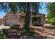 Inviting single-story home with a two-car garage and lush desert landscaping at 13861 W Elm St, Surprise, AZ 85374