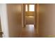 Hallway with neutral walls and tiled floors, offering seamless transition between rooms with easy maintenance at 13861 W Elm St, Surprise, AZ 85374