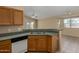 Kitchen bar overlooks a neutral living area with updated appliances at 13861 W Elm St, Surprise, AZ 85374