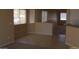 Expansive living area featuring tiled flooring, neutral color walls, and generous natural light through multiple windows at 13861 W Elm St, Surprise, AZ 85374