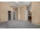 Main bedroom featuring neutral walls and floors, closet, and bath area at 13861 W Elm St, Surprise, AZ 85374