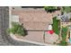 This is an aerial view of the home's roof and backyard including a grassy area and patio with umbrella at 16538 N Oachs Dr, Surprise, AZ 85374