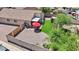 Aerial view showcasing the backyard's patio, artificial turf, and enclosed garden at 16538 N Oachs Dr, Surprise, AZ 85374