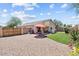 Private backyard with gravel, artificial turf, patio and outdoor seating at 16538 N Oachs Dr, Surprise, AZ 85374