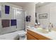 Clean bathroom with shower and tub combination, a neutral-toned sink vanity, and modern fixtures at 16538 N Oachs Dr, Surprise, AZ 85374