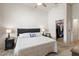 Bedroom showcasing a walk-in closet and a plush queen bed with side tables at 16538 N Oachs Dr, Surprise, AZ 85374