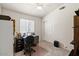 Functional bedroom with a desk setup, closet space, and plenty of room for productivity at 16538 N Oachs Dr, Surprise, AZ 85374