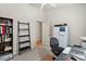Cozy bedroom features a bookshelf, ladder, and a bright white closet at 16538 N Oachs Dr, Surprise, AZ 85374