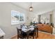 Bright dining space with a dining table, and an adjacent living area filled with natural light at 16538 N Oachs Dr, Surprise, AZ 85374
