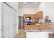 Functional kitchen featuring wood cabinetry, modern appliances, and ample counter space at 16538 N Oachs Dr, Surprise, AZ 85374