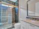 Chic bathroom featuring granite counter, glass shower with tile accents and private toilet at 16881 W Merrell St, Goodyear, AZ 85395