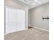 Spacious bedroom with neutral carpet and closet with lots of room for storage at 16881 W Merrell St, Goodyear, AZ 85395