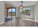 Bright dining area with sliding glass doors leading to the outdoor living space at 16881 W Merrell St, Goodyear, AZ 85395