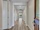 Long hallway leads to the living area and features hard surface flooring at 16881 W Merrell St, Goodyear, AZ 85395