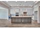Open concept kitchen with granite island and stainless appliances at 16881 W Merrell St, Goodyear, AZ 85395