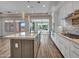 Kitchen featuring a granite island, stainless appliances, and a breakfast bar at 16881 W Merrell St, Goodyear, AZ 85395