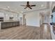 Open concept living area with a kitchen, fireplace and plenty of room for entertaining at 16881 W Merrell St, Goodyear, AZ 85395