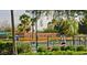 Community pickleball courts surrounded by green landscaping and tall trees at 16881 W Merrell St, Goodyear, AZ 85395